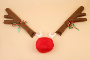 Detail of plush brown reindeer antlers and red nose car decoration with bells