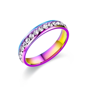 Macro shot of rainbow gradient titanium steel ring with sparkling pavé zircon setting