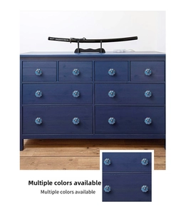 Detailed close-up of blue pumpkin ceramic cabinet handle with vintage floral patterns