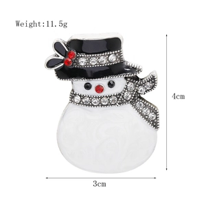 Detailed view of enamel snowman brooch with red hat and dimensions 4cm by 3cm
