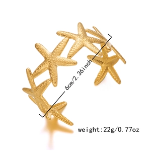 Detail of starfish open bangle in gold finish with precise 6cm diameter measurements