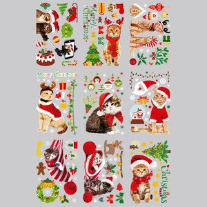 Christmas window stickers featuring cute cartoon cats in festive hats and holiday gifts