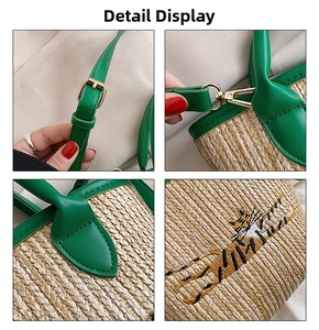 Detail of adjustable green leather strap and yellow tiger embroidery on woven straw bag