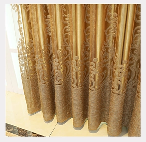 Detailed close-up of golden European-style jacquard curtain fabric with luxury textures