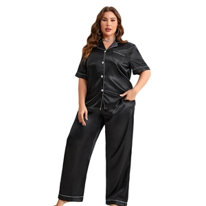 Plus size black satin pajama set with short sleeve buttoned shirt and long pants