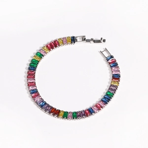 Detailed close-up of rainbow rectangular zircon bracelet with silver-tone metal setting