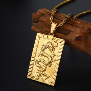 Rectangular gold plated dragon pendant with embossed design on twisted rope chain