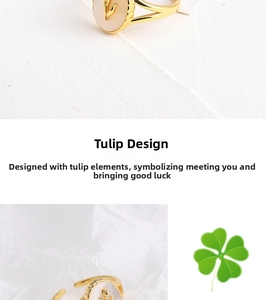 Detailed macro view of a golden tulip ring with white oval shell inlay and adjustable band