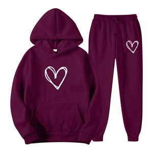 Burgundy tracksuit with white heart print featuring a drawstring hoodie and matching joggers