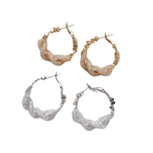 Minimalist twisted rope hoop earrings in gold and silver finish with braided metal texture