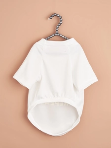 Close-up of white breathable mesh pet T-shirt with print on a pearl hanger