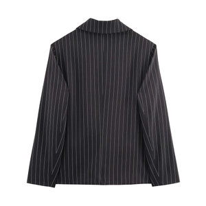 Rear view of a black pinstripe blazer with long sleeves and a minimalist commuter style