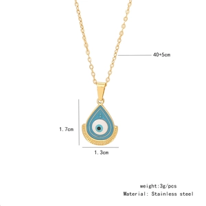 Detail view of blue evil eye palm pendant with stainless steel size and weight measurements