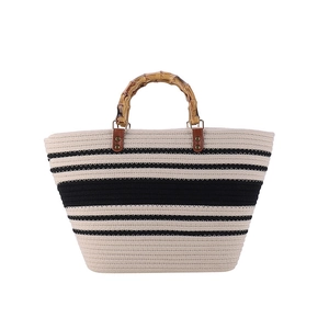 Chic beige and black striped woven tote bag with natural bamboo handles and leather details