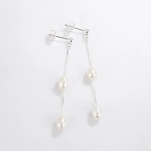 Detailed macro view of S925 silver fringe earrings with natural freshwater pearls