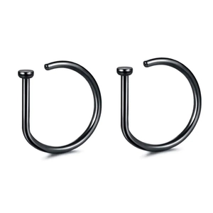 Close-up of two polished black D-shaped surgical steel nose rings on a white background