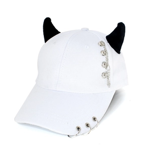 White baseball cap with black demon horns, silver rings, and a metal chain detail