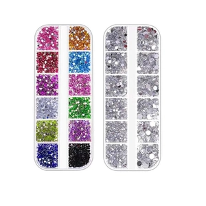 Macro detail of two 12-slot boxes containing multi-color and silver nail art rhinestones