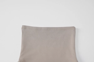 Detail of greyish-brown elastic knit fabric showing precise double-needle stitching