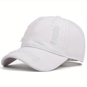 Close-up of white distressed baseball cap with ripped details and embroidery