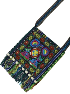 Ethnic embroidered crossbody bag with colorful floral patterns and beaded tassels