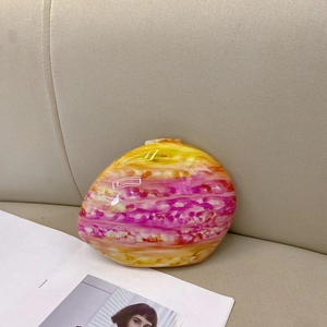Artistic marble pattern clutch bag with vibrant pink and orange glossy finish