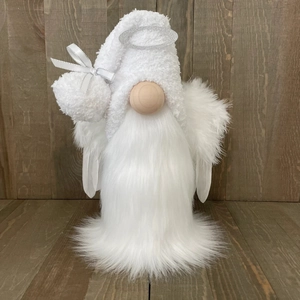 Detail of white Christmas gnome ornament with silver halo and soft feather wings