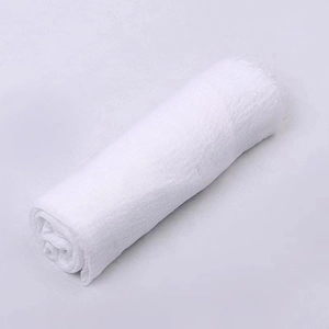 Close-up detail of white crinkle cotton scarf showing soft texture and lightweight fabric