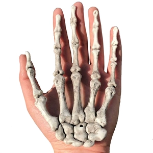 Realistic white Halloween skeleton hand prop model for spooky party wall decorations