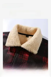 Detail of red and black plaid jacket showing warm fleece lamb wool collar and inner M tag
