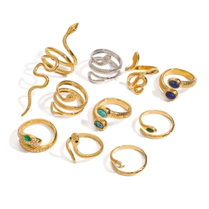 Set of snake shaped stainless steel rings in gold and silver finish with turquoise stones
