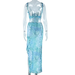 Detail of the blue floral maxi dress featuring a backless design with adjustable tie straps