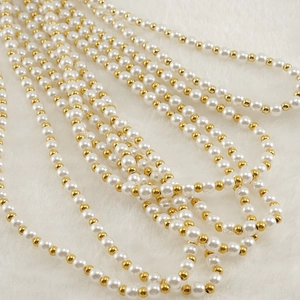 Luxurious multi-strand pearl chain necklace with alternating white pearls and gold beads