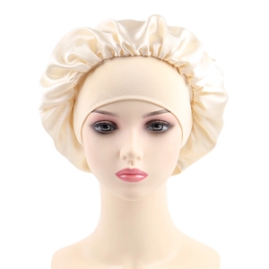 Detailed close-up of champagne satin bonnet with elastic ruffled edge on head model