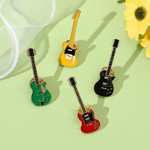 Set of four vintage electric guitar enamel pins in vibrant yellow, green, black and red