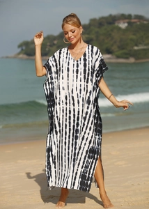Close-up of lightweight V-neck beach cover-up with black and white tie-dye stripe pattern