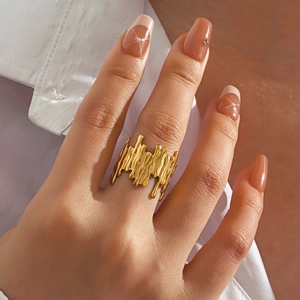 Artistic gold irregular lava fluid ring with liquid metal texture in minimalist style