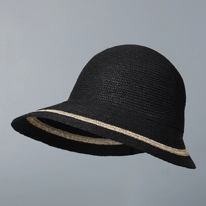Detail of black raffia sun hat featuring a contrast beige woven trim on the wide brim