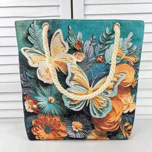 Artistic 3D butterfly jacquard tote bag with blue floral pattern and rope handles