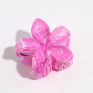 Detail of pink and white marble texture floral hair claw clip with transparent teeth