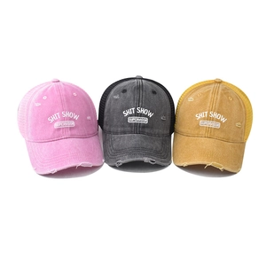 Three distressed trucker hats with Shit Show Supervisor embroidery and mesh back