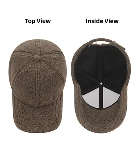 Detail view of brown sherpa baseball cap showing top texture and interior lining