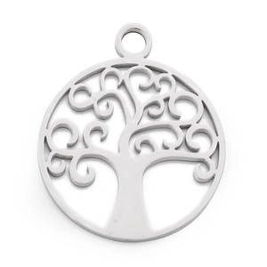 Macro view of a silver stainless steel tree of life pendant with intricate cutout details