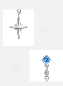 Détail macro d'une boucle d'oreille étoile en argent s925 avec zircon bleu clair
