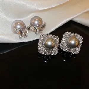Silver needle butterfly pearl earrings with sparkling diamond halo in French style