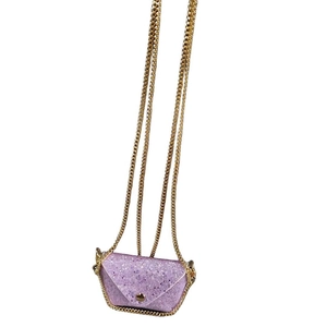 Detailed close-up of purple glitter mini pouch with gold chain strap and metal buckle