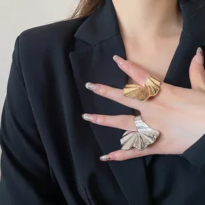 Statement pleated flower ring in gold and silver metal with textured stripe design