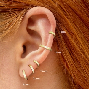 Minimalist S925 sterling silver gold hoops in 5mm to 9mm sizes shown on ear