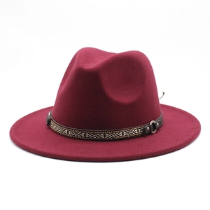 Detail of burgundy wool fedora featuring an ethnic woven band with metal ring buckle