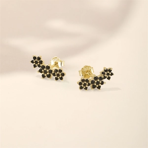 Macro shot of 925 silver butterfly earring back with S925 hallmark and black stones